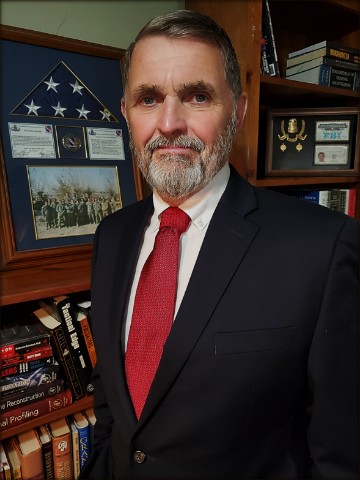 Portrait of Christopher Holland, FBI Special Agent (Ret.)